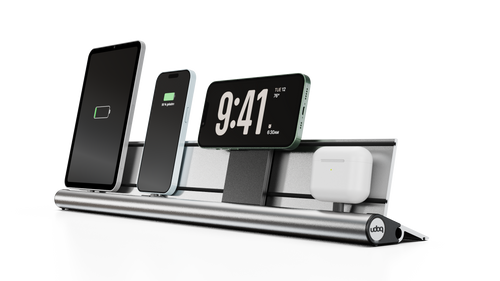 Multi-device charging station in silver with smartphone, tablet, and airpods on a white background